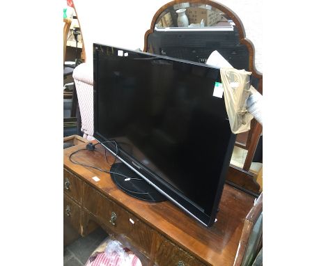 A Panasonic Viera 37" LCD TV with manual and remote 