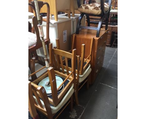 A set of 4 light wood dining chairs and a standard lamp 