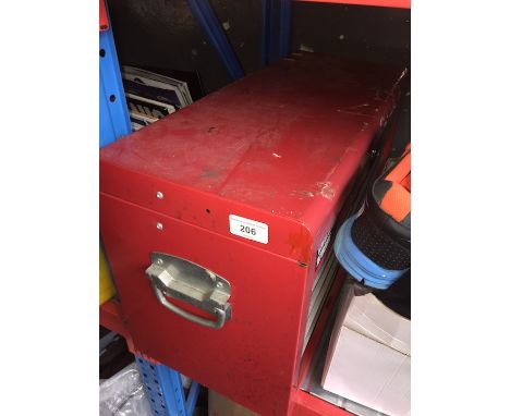 A red metal toolbox with tools 