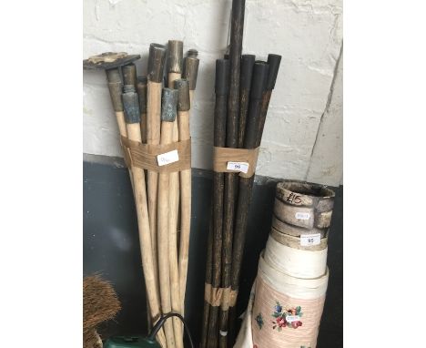 Two sets of drain rods, a bundle of garden tools and a snow shovel 