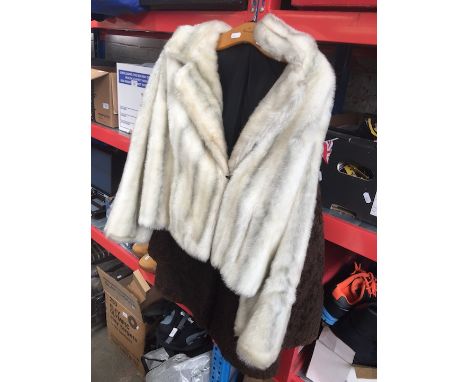 A faux fur jacket and another ladies coat 