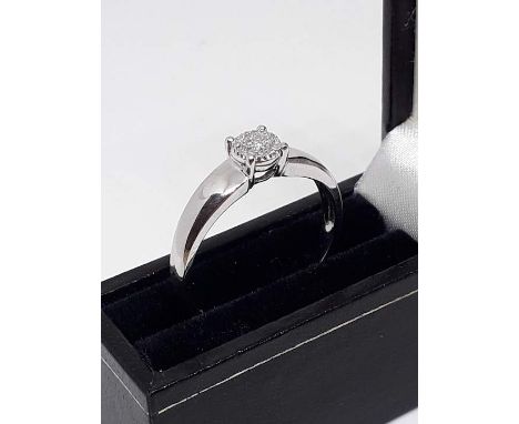 A hallmarked 9ct white gold ring set with colourless stones, gross wt. 2.7g, size U. 