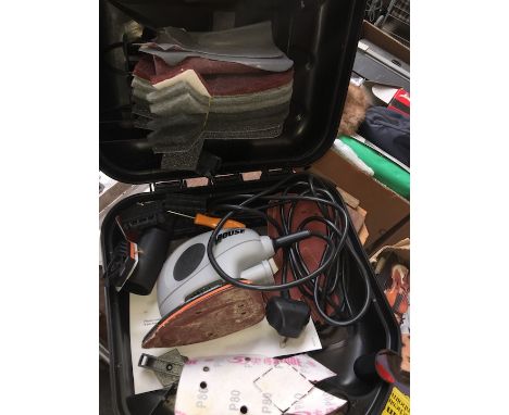 A Black and Decker palm sander 