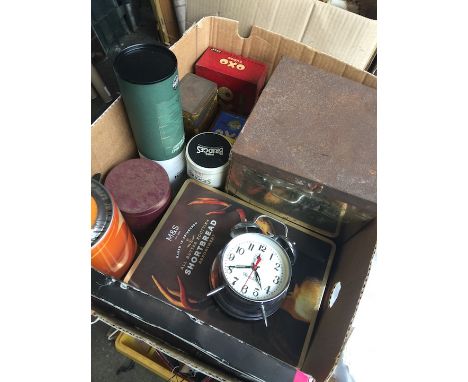 A box of old tins, alarm clock, etc 