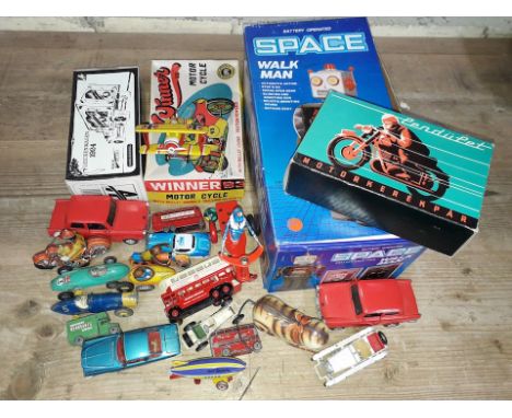 A mixed lot of toys including a tinplate Space Walk Man robot, various tinplate circa 1950s and later, Dinky Toys, a Hearse a