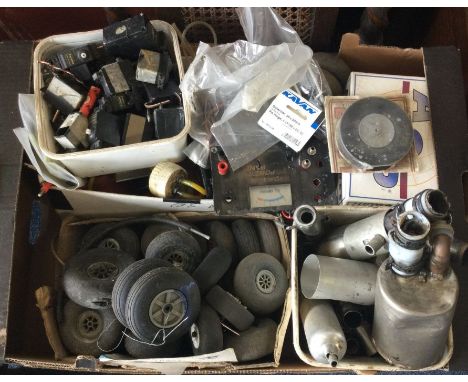 A box containing model aircraft wheels etc. Est. £10 - £20.