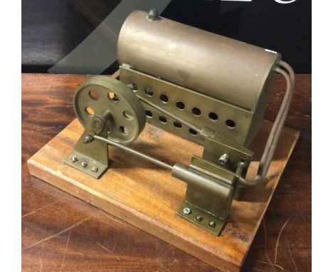 A scratch-built model stationary engine. A model stationary engine comprising twin cylinders and a 3 inch diameter copper boi