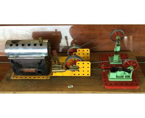 A Meccano steam engine together with Mamod hammer and power press on a wooden board. Est. £40 - £50.