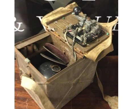 A British WWII Signal Lamp with Morse Code Key. Has been kept in storage and unused for a long time but looks to be original.