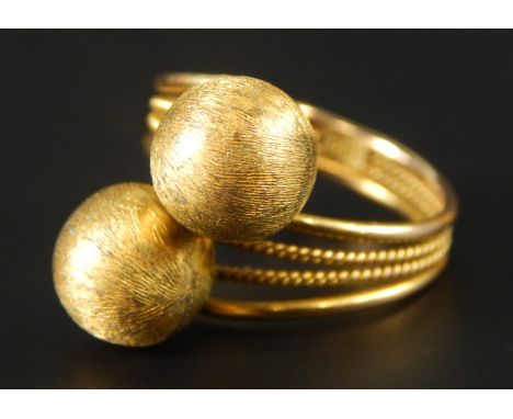 An abstract dress ring, of four row design with two balls, yellow metal, marked 14K, 5.4g all in. 