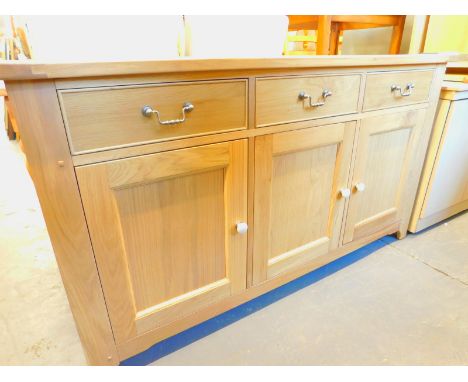 A Wills & Gambier light oak sideboard, with three drawers