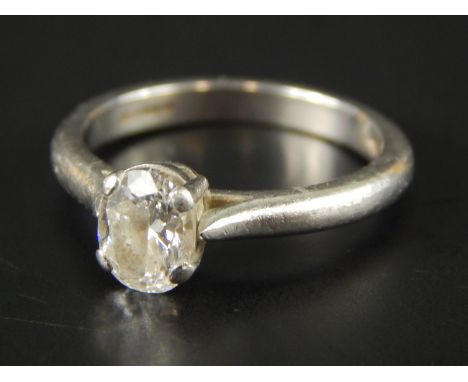 An Asprey platinum diamond solitaire ring, the diamond 0.65cts, oval brilliant cut, complete with GIA report, 3.8g all in, in