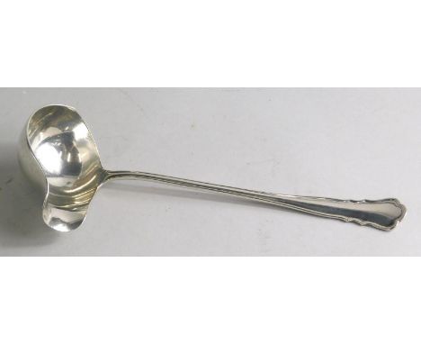 A spirit ladle, with shaped bowl and stylised trefoil end, German white metal marked 800, 20cm wide.