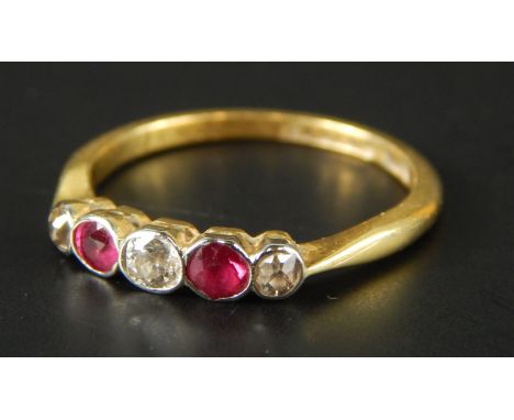 A ruby and diamond five stone dress ring, with three diamond and two rubies each in rub over setting, yellow metal, marked 18