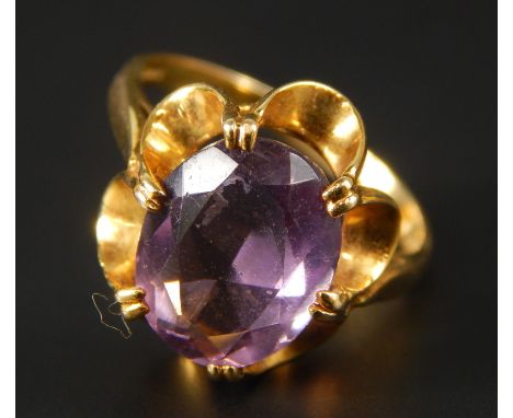 A 9ct gold amethyst dress ring, with floral wavy borders, 3.5g all in.