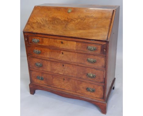 A George III mahogany bureau, the fall enclosing a fitted interior, above four graduated drawers, on bracket feet, 81cm wide 