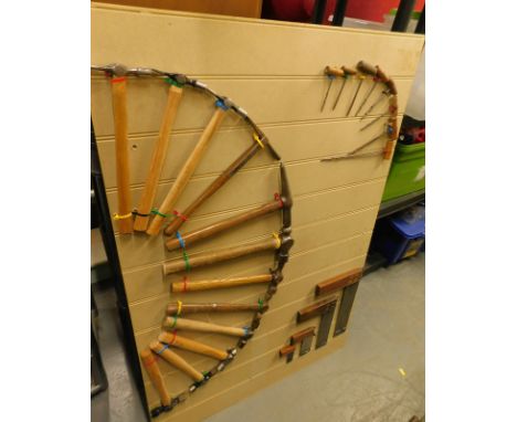 A collection of vintage tools,  screwdrivers,  hammers, set squares etc., mounted onto modern boards