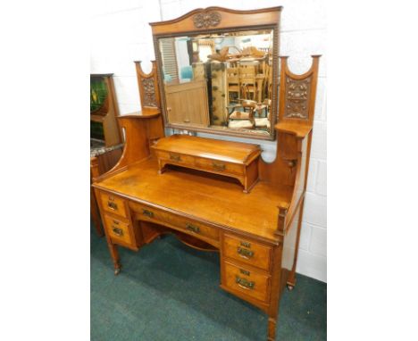 An Art Nouveau Shapland and Petter of Barnstable oak and ash dressing table, the raised back with a rectangular bevelled mirr