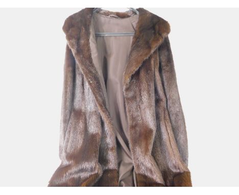 A full length fur coat, and an associated hat