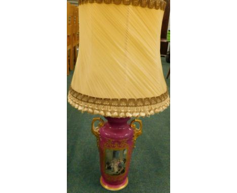 A late 19thC Paris porcelain two handled vase, decorated to one side with a wedding scene, picked out in gilt, on a puce grou