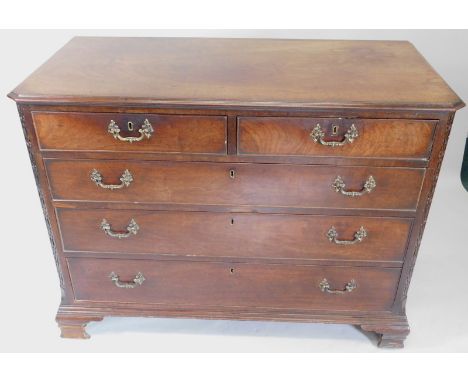 A George III mahogany chest of drawers, the rectangular top with a moulded edge, and canted corners, above two short and thre