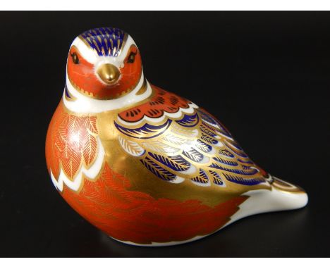 A Royal Crown Derby porcelain paperweight, modelled in the form of a seated bird, silver button