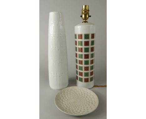 A West German semi-porcelain table lamp, decorated with a repeat geometric pattern, 35cm high, bisque floral plate and a shap