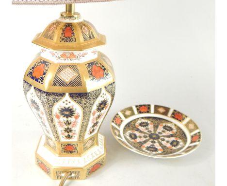 A Royal Crown Derby Imari pattern table lamp, with shade, 54cm high overall, and a Royal Crown Derby saucer. (2)