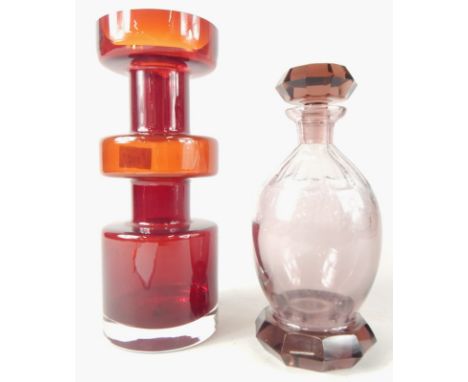 A decorative Dartmouth type ruby tinted three section glass vase, 28cm high and a Bohemian style pink tinted decanter and sto