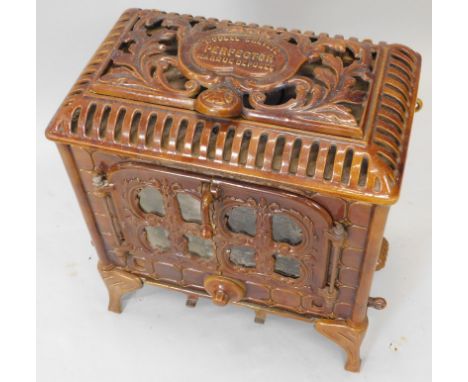 A French brown enamel stove, the pierced top stamped Perfector etc., 50cm wide