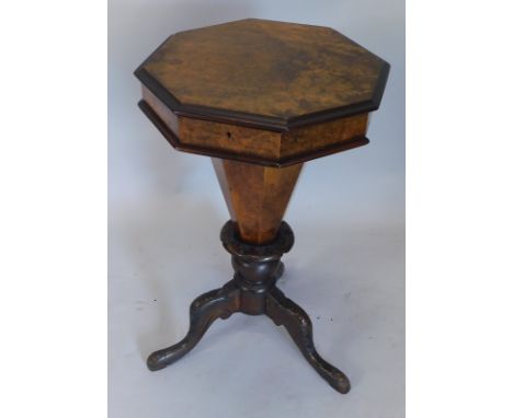 A Victorian burr walnut trumpet shaped work table, the hinged lid enclosing a fitted interior, on a carved tripod base, 43cm 