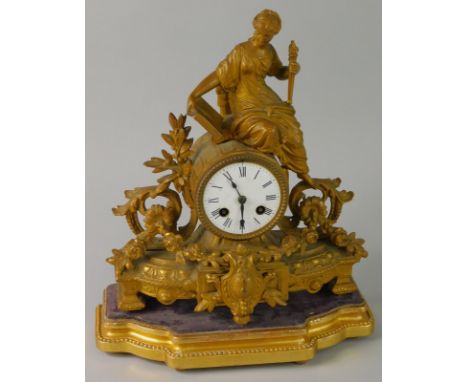 A late 19thC French figural mantel clock, with a white enamel dial and gilt base, 30cm wide