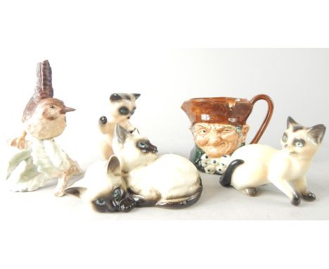 A collection of ceramics, to include Beswick Siamese cat group, two Goebel Siamese cats, a Goebel bird and a medium sized Roy