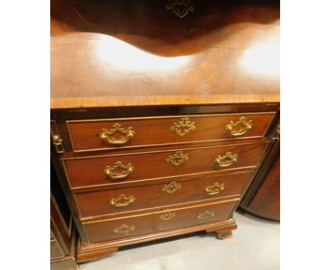 A mahogany bureau in George III style, the top drawer stamped from W Williams & Sons Guildford, the crossbanded fall above th