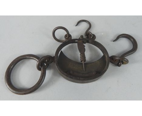 A set of 19thC iron wool scales, calibrated to the centre, applied with various hooks and loops