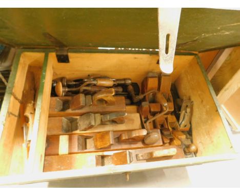 A green painted pine tool chest, containing a large quantity of block planes, metal planes and other tools etc.