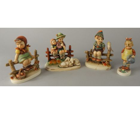 Various Goebel Hummel figures, to include children on fence beside sheep, 14cm high, figure number 1938 Girl on Fence etc. (4