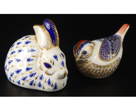 Two Royal Crown Derby porcelain paperweights, a small bird and a seated rabbit, both gold button and boxed