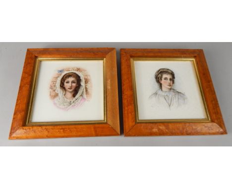 A pair of Mintons tiles, each later painted with a portrait of a lady, bearing initials DLG, 14.5cm wide