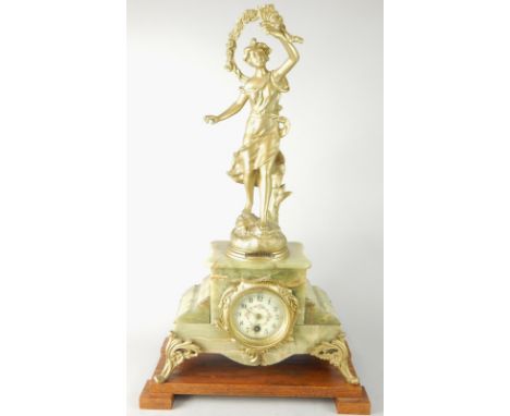 A late 19thC French gilt spelter and onyx mantel clock, the top mounted with a figure tilted Brise D'ete, the dial painted wi