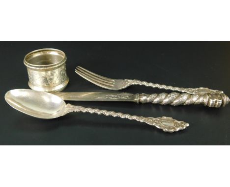 A mid Victorian silver three piece set of christening cutlery, to include a fork, spoon and knife, London 1887, and an associ