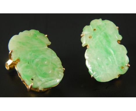 A pair of jade earrings, in pierced frames, on clip backs, marked 14K, 5.1g all in. 