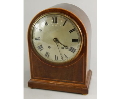 A late 19thC mahogany mantel clock, with an arched case, silvered dial, brass movement, 36cm high.