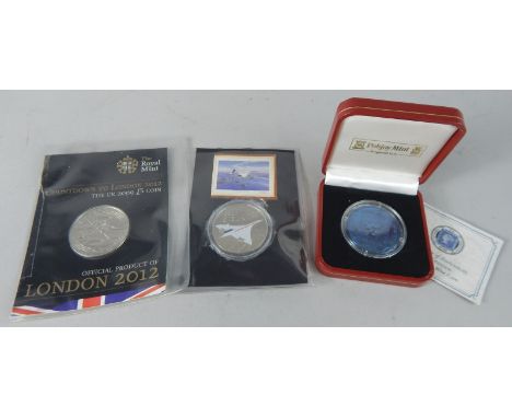 A Pobjoy proof five pound titanium tupenny blue coin, a Concorde crown, and London 2012 crown. (3)