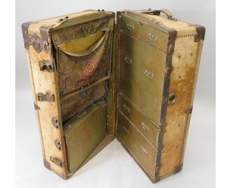 An early 19thC canvas and metal bound wardrobe trunk, initialled W.B.