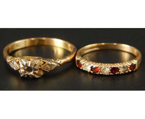 Two dress rings, to include a 9ct gold dress ring set with garnet and white stones, and another lacking stone, marked 18ct, 4