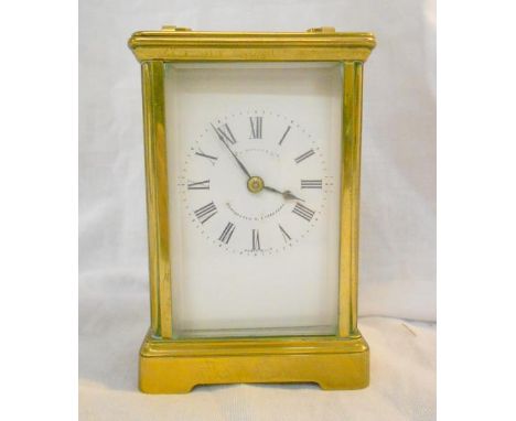 Early C20th 8 Day Brass Cased Carriage Clock, hour strike, white enamelled dial with Roman numerals, marked Finnigan's Ltd. M