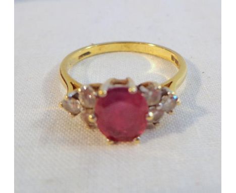 18ct Gold Ruby & Diamond Ring, central oval facet cut ruby, each shoulder set with 3 matching diamonds, size N 1/2 