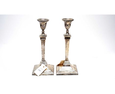 A pair of silver candlesticks, Harrison Brothers &amp; Howson (George Howson), Sheffield 1927, of Adams style with swag desig