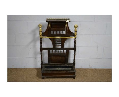 Manner of James Shoolbred &amp; Co: a late Victorian oak and brass stick stand, with raised three-quarter gallery above a pan